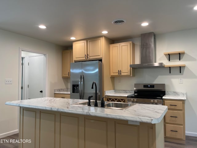 kitchen featuring sink, wall chimney exhaust hood, dark wood-type flooring, an island with sink, and appliances with stainless steel finishes