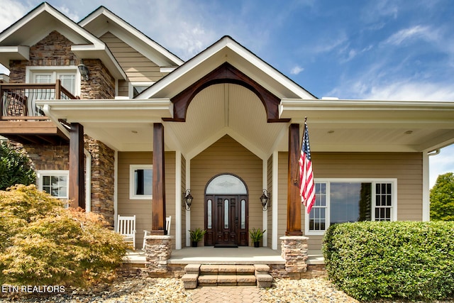 property entrance featuring covered porch