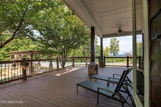 wooden terrace featuring ceiling fan