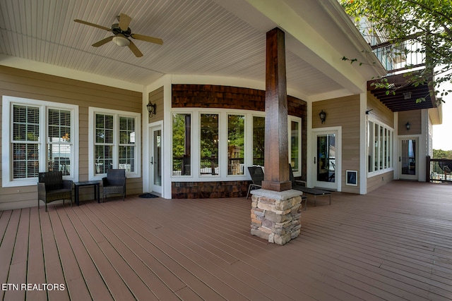 wooden deck with ceiling fan