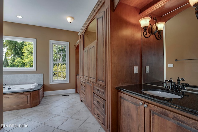 bathroom featuring a tub and vanity