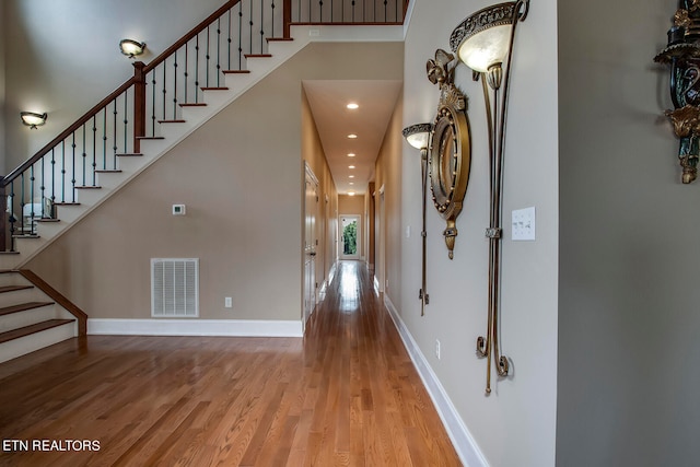 foyer entrance with wood-type flooring