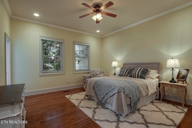 bedroom with dark wood-type flooring, ceiling fan, and ornamental molding