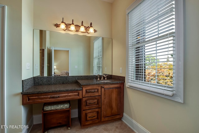 bathroom with vanity and tile patterned flooring