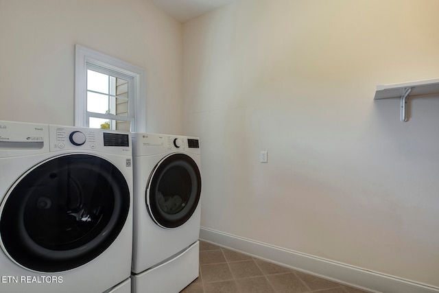 clothes washing area featuring independent washer and dryer