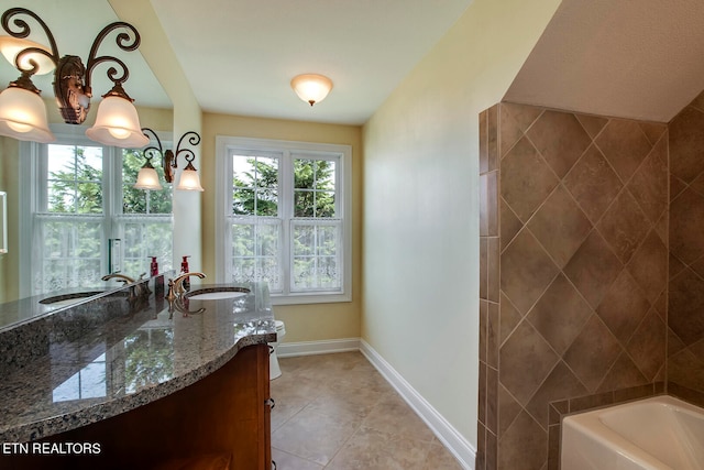 bathroom featuring vanity, a bath, and tile patterned flooring