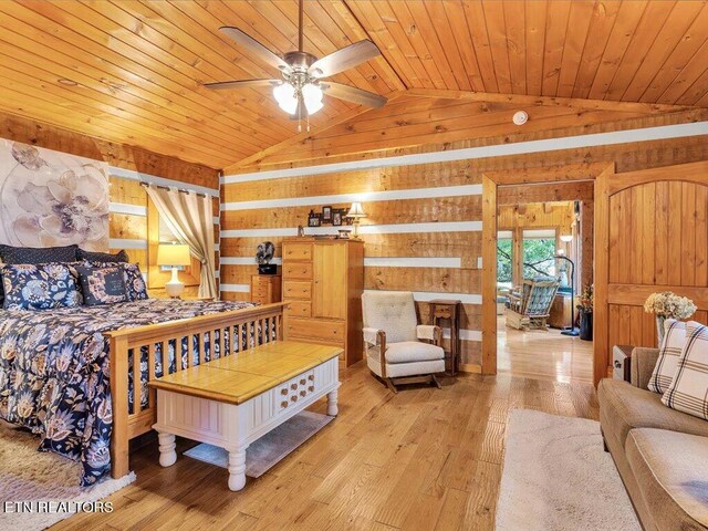 bedroom featuring wooden ceiling, lofted ceiling, light hardwood / wood-style flooring, and wood walls