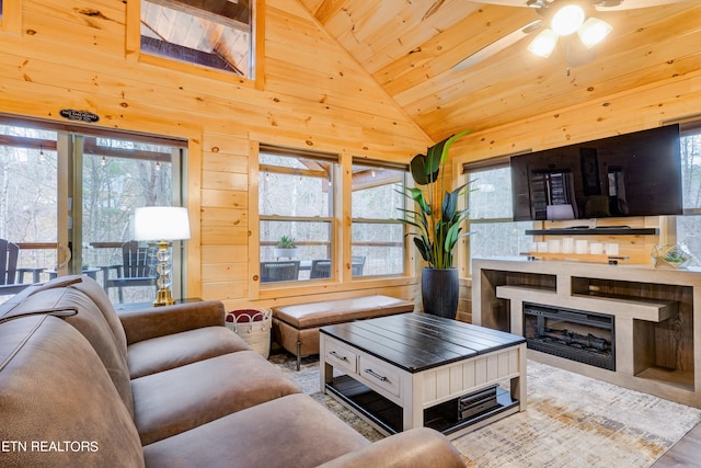 living room featuring wood ceiling, ceiling fan, hardwood / wood-style flooring, and plenty of natural light