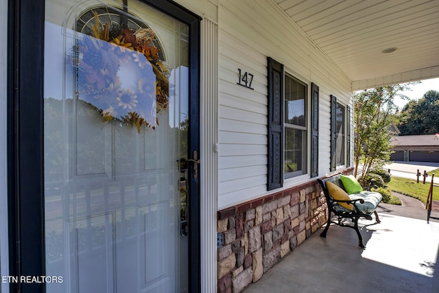 doorway to property featuring a porch