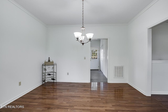 unfurnished dining area featuring crown molding, visible vents, a notable chandelier, and wood finished floors