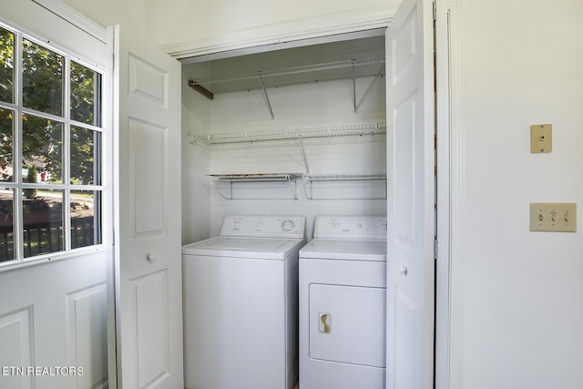 laundry area with laundry area and washer and clothes dryer