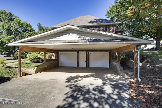 view of side of home with a shingled roof and brick siding