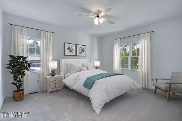 bedroom with ceiling fan and carpet