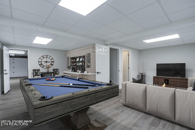 recreation room featuring billiards, a drop ceiling, and wood finished floors