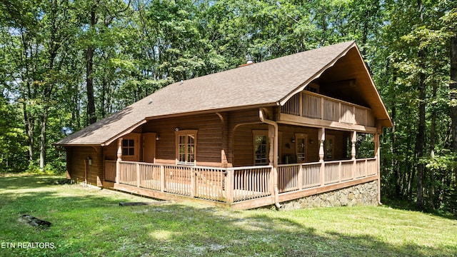 view of side of home featuring a yard