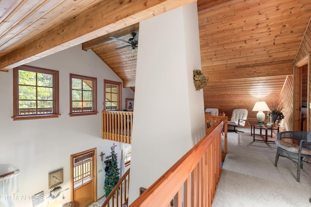 corridor with high vaulted ceiling, carpet, wooden ceiling, and beam ceiling