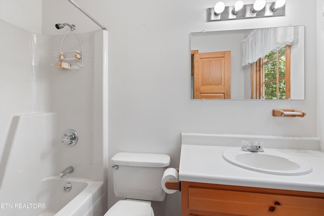 full bathroom featuring vanity, toilet, and bathing tub / shower combination