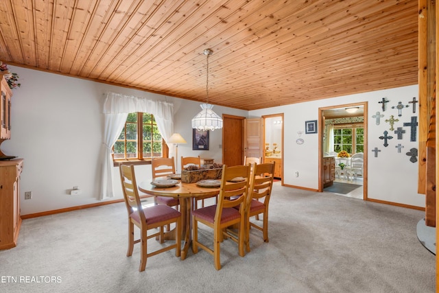 carpeted dining area with wood ceiling and a chandelier