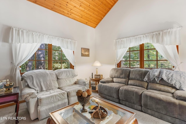 living room with wood ceiling, high vaulted ceiling, plenty of natural light, and carpet