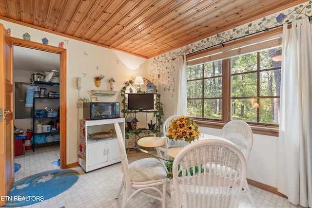 dining room with wooden ceiling and crown molding