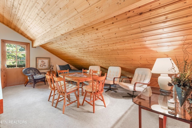 carpeted dining room with vaulted ceiling and wooden ceiling