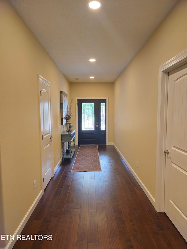 doorway featuring dark wood-type flooring