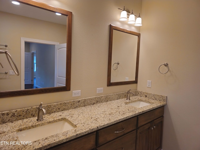 bathroom featuring double vanity and a sink