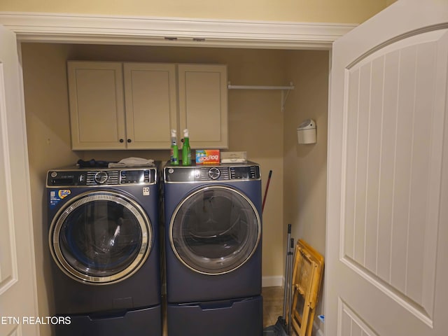 laundry area with cabinet space and washer and clothes dryer