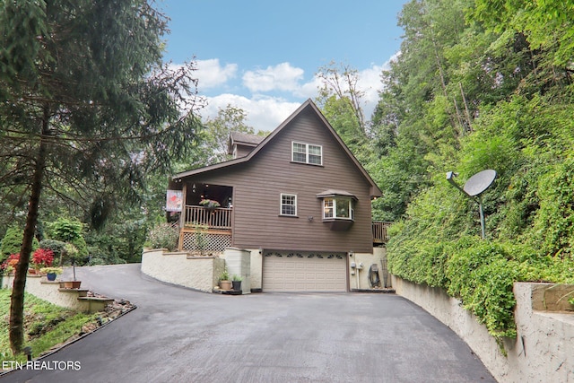 view of side of property with a garage