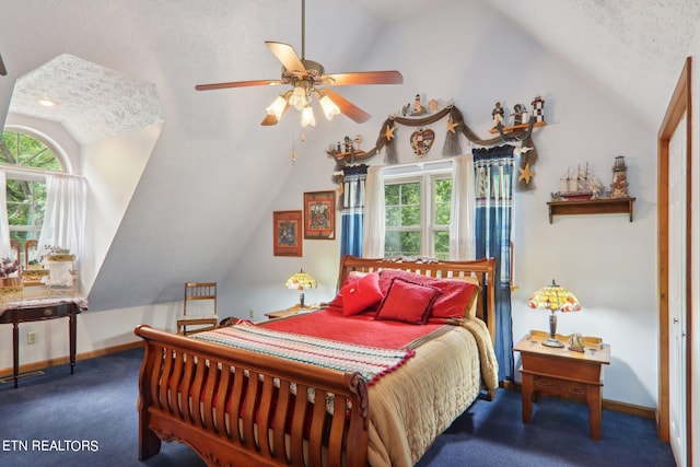 bedroom featuring lofted ceiling, ceiling fan, and dark colored carpet