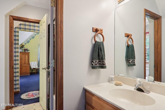 bathroom featuring vanity and a textured ceiling