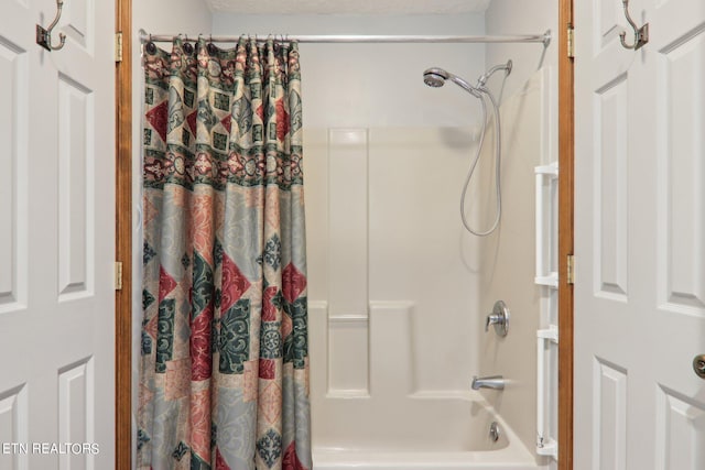 bathroom featuring shower / bathtub combination with curtain