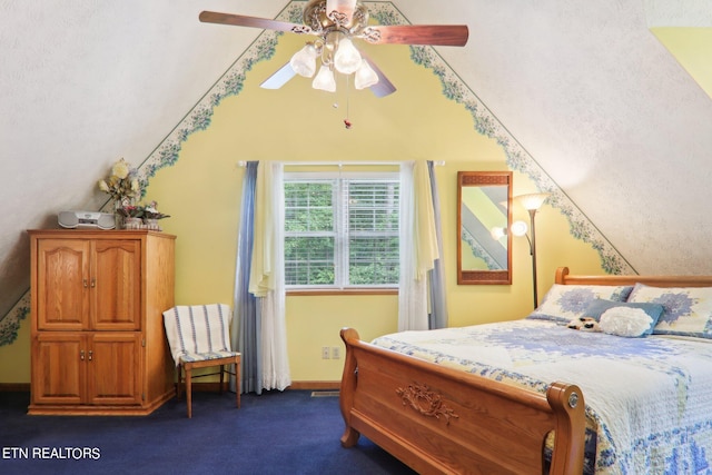 bedroom with dark colored carpet and ceiling fan