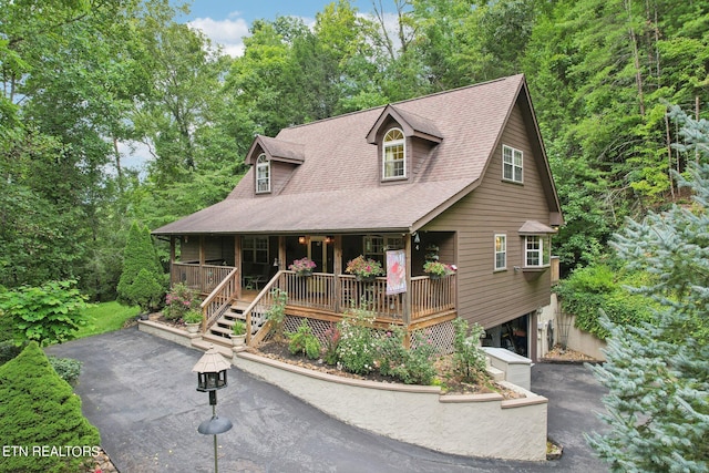 3138 Cool Creek Rd, Sevierville, TN 37862 - rustic home with a porch, driveway, and a shingled roof