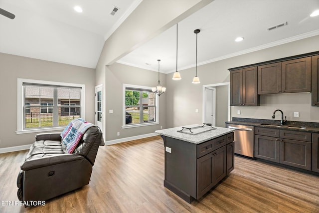 kitchen with dishwasher, plenty of natural light, light hardwood / wood-style floors, and sink