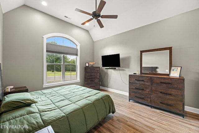 bedroom featuring lofted ceiling, ceiling fan, and light hardwood / wood-style floors