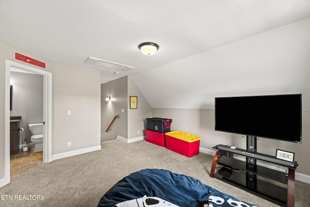 interior space featuring lofted ceiling and carpet