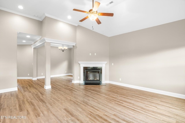 unfurnished living room featuring baseboards, visible vents, a ceiling fan, and light wood finished floors