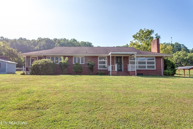 ranch-style house with a front lawn and a gazebo