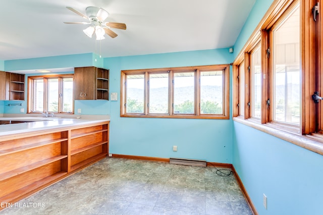 kitchen with ceiling fan and a wealth of natural light