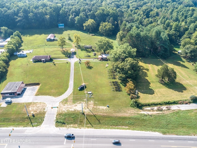 birds eye view of property with a rural view