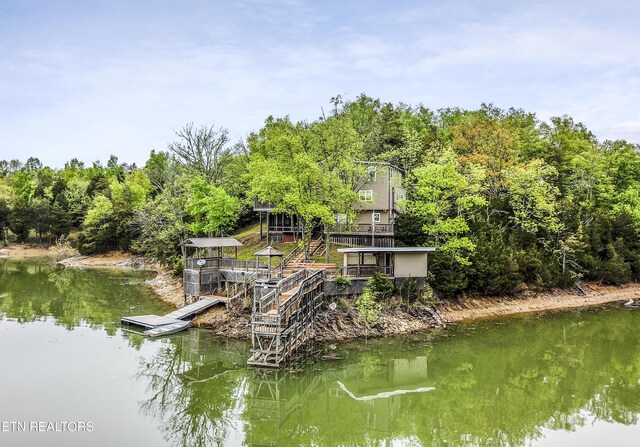 dock area featuring a water view and stairs