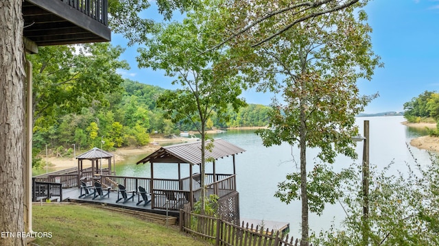 view of dock with a water view and a gazebo