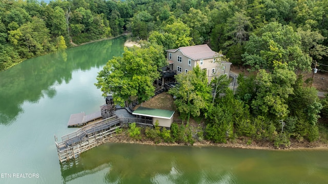 bird's eye view featuring a water view and a forest view