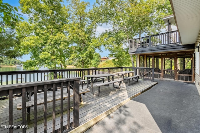 wooden terrace with outdoor dining area