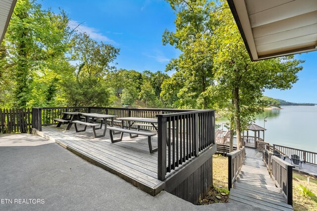 deck featuring a water view