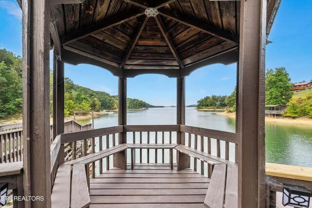 view of dock featuring a water view and a gazebo