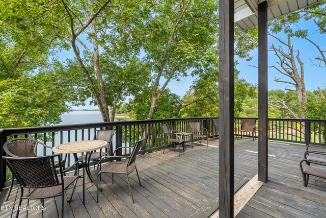 deck featuring a water view