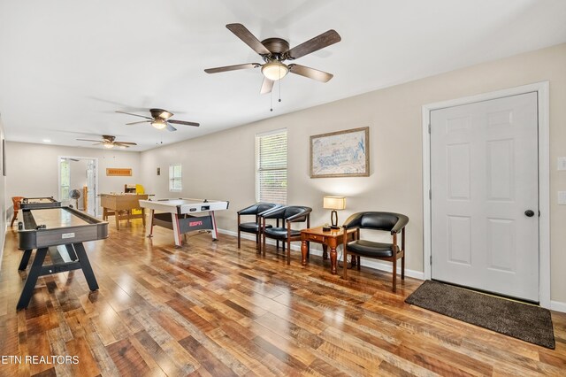 interior space with ceiling fan and hardwood / wood-style floors