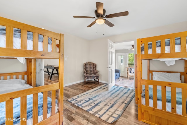 bedroom featuring baseboards and wood finished floors